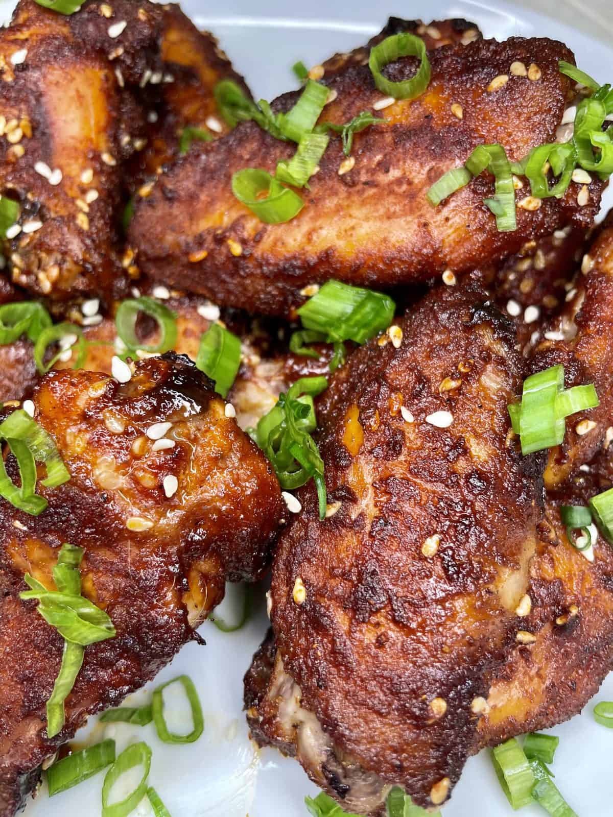 sweet and smoky asian wings on a plate
